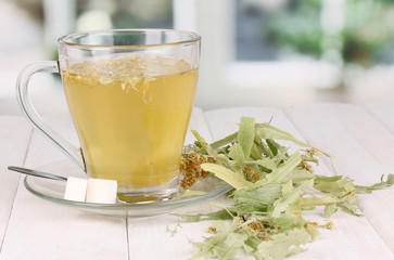 Glass cup of tea with linden