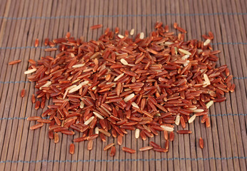 red rice   on bamboo mat