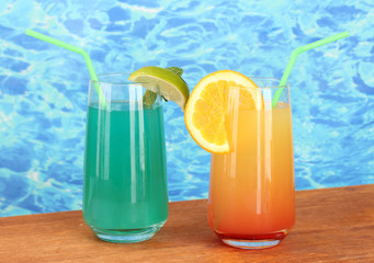 Two cocktails on blue background