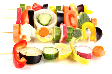 Sliced vegetables on wooden pick isolated on white