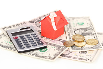 Small house and money isolated on white