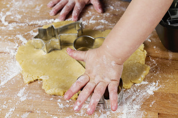 small childrens hands with dough