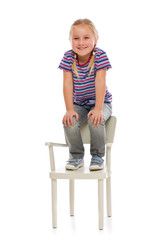 smiling girl sitting on a chair