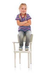 smiling girl sitting on a chair