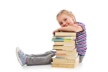 little girl with a pile of books