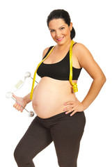 Healthy pregnant holding scales