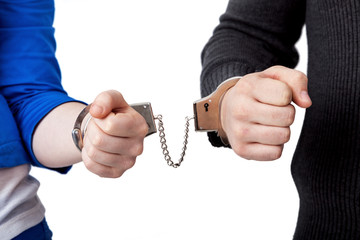Men and women connected with handcuffs