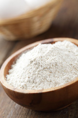Wholemeal flour in wooden bowl