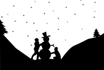 Silhouette of a two kids make a snowman in winter in mountain