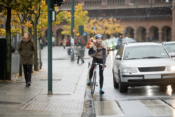 Male Cyclist Using Walkie-Talkie On Street