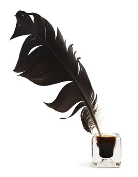 Feather and ink bottle isolated