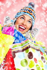 Beautiful christmas girl with shopping bags.