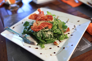 Salad with ham in restaurant