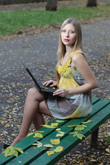 A beautiful model working on a computer.