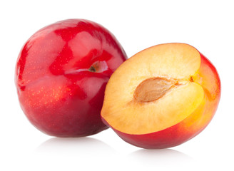 red plums isolated on white