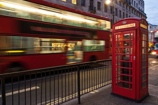 Double decker bus and red telephone box in London at night