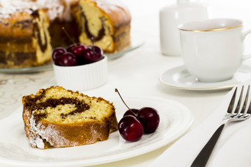 Sliced marble cake with a cup of tea