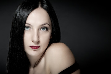 Fototapeta premium Portrait of beautiful girl with black hairs