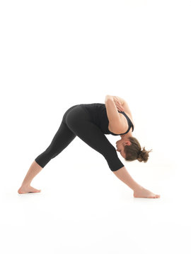yoga posture demonstration by young female instructor