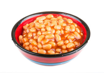 Marinated haricot beans in tomato sauce with shallots on a plate