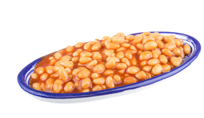 Marinated haricot beans in tomato sauce with shallots on a plate