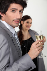 Elegant man drinking champagne