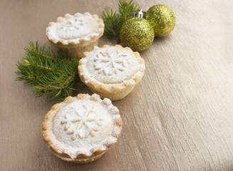 Christmas short crust pastry mince pies on golden background