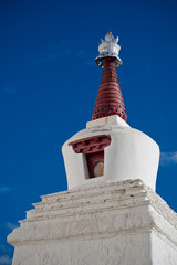 Buddhist stupa over blue sky at Thiksey Gompa. India, Ladakh