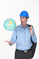 Engineer tossing a globe