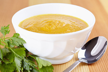 Pumpkin soup in white plate