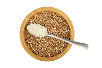 wood bowl with buckwheat and steel spoon with rice