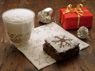 Christmas coffee break with decorated chocolate brownie