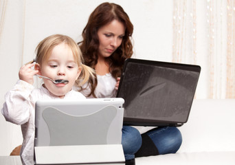 Mother and baby with laptop