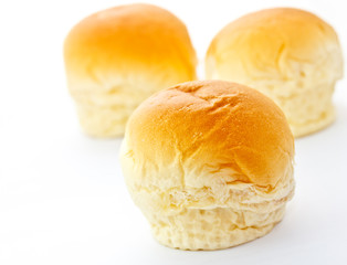 three loafs of bun on white background