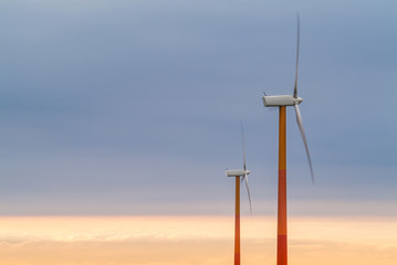 Fototapeta premium Red and orange wind turbines
