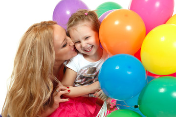 Obraz premium Mother kiss her little happy daughter