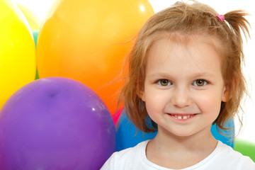 Fototapeta na wymiar Portrait of little girl with color balloons