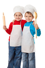 Little cooks with ladle and rolling pin