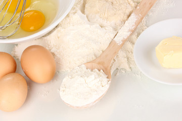 Eggs, flour and butter close-up isolated on white