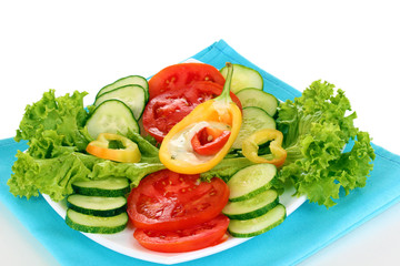 Chopped vegetables and sauce on plate isolated on white