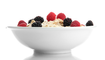 tasty oatmeal with berries, isolated on white