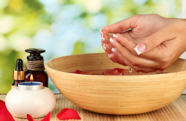 spa treatments for female hands,  on green background