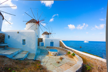 Panoramic view of two windmills and their bases Mykonos Greece C