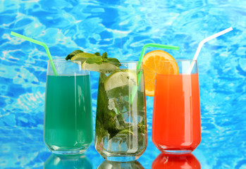Three cocktails on blue background