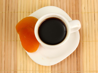 Cup of coffee on brown background