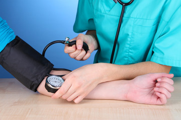 Blood pressure measuring on blue background