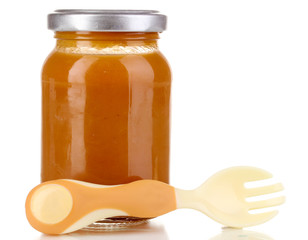 Useful and tasty baby food with beige small fork isolated