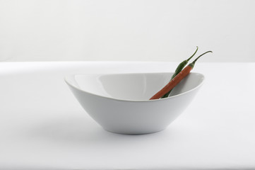 White china bowl and peppers