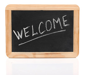 word "welcome" - white chalk handwriting on small school wooden