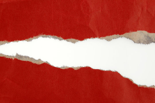 Ripped red paper on white